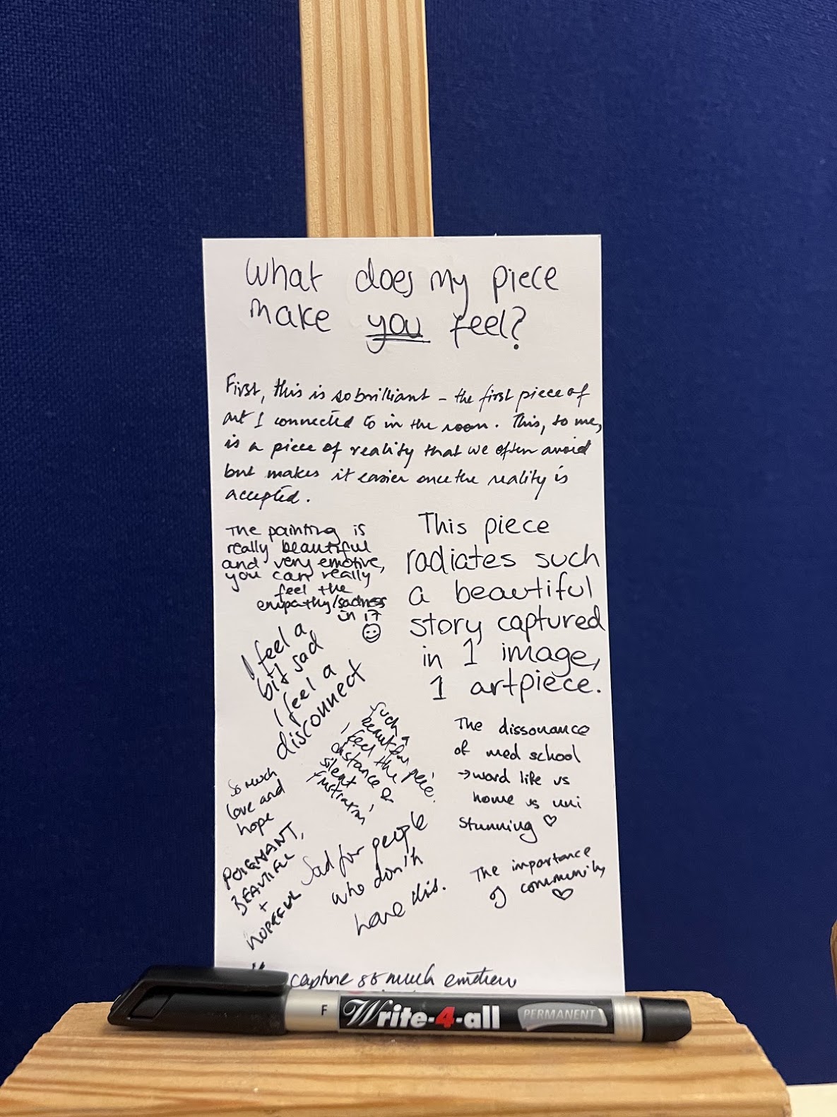 Handwritten card beside I’ll drive asking “What does my piece make you feel?”, filled with visitors’ responses